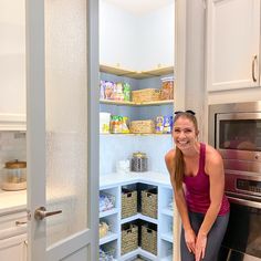 a woman kneeling down in front of an open pantry door with baskets on the shelves