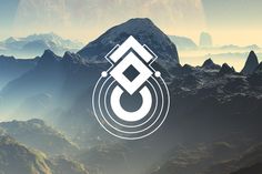 an image of a mountain range with the letter g in it's center surrounded by mountains