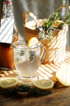 a glass mug filled with ice and lemon slices