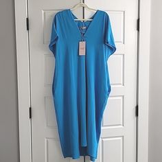 Bought This Dreamy Lightweight Summer Dress In The Uk In 2022. Super Flattering And Very Forgiving Of Areas You Might Not Like Like Your Stomach Or Thighs. If You're Not Familiar With What A Crescent / Dolman / Kaftan / Narrow Hem Batwing Dress Looks Like On, I'm Adding A Photos At The End In A Different Color So You Have An Idea. It Doesn't Fit Me Now, It's A Size L-Xl (So 14-16). I'm A 12 Now And It's Too Big (See Last Photo). Hangs Loose (It's Supposed To), Flowy Fabric, Moves Like A Dream. O Blue V-neck Maxi Dress For Daywear, Blue Oversized Short Sleeve Dress, Oversized Blue Midi Dress, Oversized Blue Short Sleeve Dress, Blue Relaxed Fit Maxi Dress For Daywear, Blue Tunic Dress With Relaxed Fit, Blue Relaxed Fit Tunic Dress, Blue Relaxed Fit Dress For Loungewear, Relaxed Fit Blue Dress For Loungewear