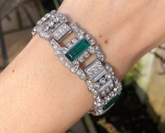 A lovely art deco bracelet made from a base metal with a rhodium plating and set with sparkling paste stones that frame green glass panels. The bracelet fastens with a concealed push clasp. There is some wear to the rhodium plating on the base of the bracelet. There is also some discolouration to some of the clear rectangular paste stones. The bracelet remains in good condition overall and looks fab on. All orders placed will be wrapped in bubble wrap and tissue paper and posted in a cardboard l Art Deco Green Bracelets For Formal Occasions, Art Deco Green Bracelet For Formal Occasions, Green Art Deco Bracelets For Formal Occasions, Green Art Deco Bracelet, Jewelry Wishlist, Bracelet Art, Art Deco Bracelet, Glass Panels, Chain Link Bracelet