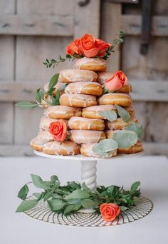 a wedding cake made out of donuts and flowers