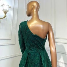 Emerald Green Elegance: The rich emerald green color exudes opulence and sophistication, making a bold statement at any event. One-Shoulder Design: The one-shoulder neckline adds a touch of modernity and asymmetry to the dress, creating a visually striking look. Mermaid Silhouette: The mermaid silhouette beautifully accentuates your curves, ensuring an elegant and flattering fit. Overskirt Detail: The overskirt adds drama and flair to the dress, giving you the option to create different looks th Fitted Dark Green Evening Dress For Party, Fitted Dark Green Evening Dress, Green One-shoulder Gown For Gala, Fitted Dark Green Evening Dress For Gala, Green Formal Ball Gown With Fitted Bodice, Formal Green Ball Gown With Fitted Bodice, Green Ball Gown With Fitted Bodice For Formal Occasions, Green Formal Dress For Party Season, Green One-shoulder Evening Dress For Wedding