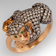 An incredible Neda Behnam rose gold and black rhodium monkey ring. The monkey is accented with two hundred twenty (220), bead set, round brilliant cut champagne colored diamonds. A round mixed cut natural tsavorite is flush set into each eye. The ring measures 15.7mm at the top, rises 11.1mm above the finger, tapering to 2.9mm wide and 1.1mm thick at the base of the shank. The ring is currently a size 10 and we offer complimentary resizing to fit. Monkey Cocktail, Figural Jewelry, Vintage Jewellery Rings, Animal Rings, Bead Set, Put A Ring On It, Champagne Diamond, Black Rhodium, Pearl Diamond