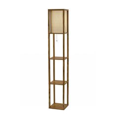 a tall wooden shelf with a lamp on it's top and two shelves below