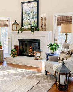 a living room filled with furniture and a fire place in the middle of the room