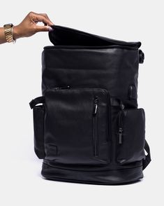 This backpack in "Mero" black with black interior is a head turner. This sleek design bridges the gap between fashion and sustainability. Each backpack allows for seamless transition from a day in the office to an overhead compartment bag for your next vacation. The T|W backpack is consciously handcrafted with premium cruelty-free vegan leather that outperforms animal-based materials. Our light weight bag is: [Light weight & Water-Resistant] The bag is super practical for carrying your every day Black Anti-theft Backpack For On-the-go, Black Laptop Bag With Luggage Sleeve For Commuting, Black Laptop Bag Backpack With Luggage Sleeve, Modern Black Backpack For On-the-go, Black Rectangular Backpack With Luggage Sleeve, Versatile Leather Anti-theft Backpack, Versatile Anti-theft Leather Backpack, Versatile Black Travel Bag For Commuting, Modern Backpack With Anti-theft Pocket For Trips