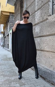 "Be wonderful with this beautiful Zen tunic dress. So light and pleasant to wear. Change shoes and jewelry and will change the fashion style. BE DIFFERENT! BE UNIQUE! BE FEMININE! It's so easy with this amazing top. This tunic dress is treasure in your wardrobe. SMILE! HEIGHT OF MODEL: 168 cm. / 5′ 6″ Size S All garments are handmade. Please provide your PHONE NUMBER for delivery EXPRESS delivery for ALL ORDERS Accessories are not for sale. If you have different measurements please inform us. SI Black Maxi Dress With Draped Sleeves, Black Batwing Sleeve Evening Dress, Black Evening Dress With Batwing Sleeves, Black Lagenlook Tunic Dress, Oversized Long Dress For Party, Oversized Long Dresses For Party, Long Oversized Dresses For Parties, Oversized Long Party Dresses, Oversized Maxi Dress For Evening