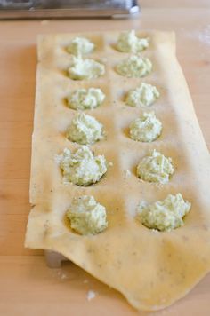 some food is laying out on top of a piece of wax paper and ready to be put in the oven