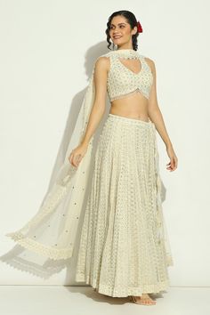 Ivory attached cancan lehenga with chikankari, swarovski embroidery in stripe pattern. Paired with halter neck embroidered padded blouse and cutwork border embroidered dupatta. - Aza Fashions Swarovski Embroidery, Cancan Lehenga, Lehenga Pattern, Net Embroidery, Padded Blouse, Embroidered Lehenga, Embroidered Dupatta, Hem Blouse, Cut Work