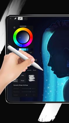 a person holding a pen and drawing on an ipad