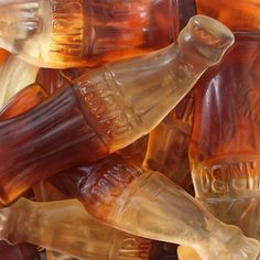 some brown and white glass bottles are stacked together