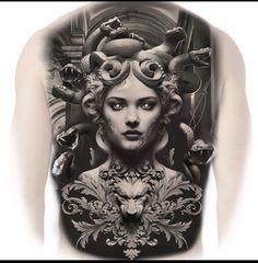 the back of a woman's body is covered in tattoos and art nouveau designs