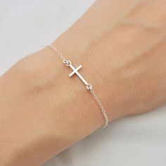 ALL SOLID 925 STERLING SILVER - A QUALITY BRACELET I make this lovely bracelet using a solid sterling silver cross that measures just under 3/4 inch long. A sturdy sterling silver chain and lobster clasp make this a durable bracelet. Makes a wonderful layering bracelet when paired with my other pieces. Comes in a gift box perfect for gift giving. SIZING - IMPORTANT: To determine bracelet size, measure snugly around your wrist and add 1/2 inch. If you don't know your size, you can use the sizing Silver Cross Bracelet, Cross Gift, Tiny Cross, First Communion Gifts, Confirmation Gifts, Long A, Cross Bracelet, Layered Bracelets, Sterling Silver Cross