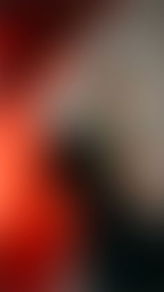 blurry image of an orange and black background