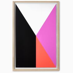 an abstract painting with black, pink, and orange colors in a wooden frame on a white wall