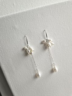 'KARINA' earrings are for brides looking romantic elegance. Clusters of freshwater nugget pearls are attached to sterling silver french hook findings and sterling silver chain with a dangling freshwater rice pearl.  Sent beautifully packaged in Medze Bride gift box. As 'Karina' earrings are made to order and due to hygienic reasons I cannot accept refunds/exchanges. But if you have any problems with your order please email me and I'll be happy to help you. Bride Pearl Earrings, Bridal Pearl Drop Earrings, Pearl Drop Earrings Bridal, Bridal Jewelery, Bride Gift, Wedding Jewellery, Bridal Pearls, Earrings Sterling Silver, Pearl Drop Earrings