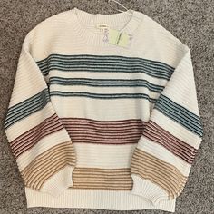 This Adorable Cable Knit Sweater Is Perfect For Winter! Cozy Striped Knitted Tops, Cozy Knitted Striped Tops, Cozy Multicolor Sweater For Loungewear, Striped Knit Sweater For Loungewear, Striped Sweater For Fall Loungewear, Multicolor Cotton Knit Top For Fall, Black Cropped Sweater, Womens Black Sweater, Oversized Grey Sweater