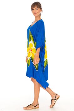 Get ready for the perfect lounge dress/coverup. It is a piece of art you can wear. Short sleeve caftan makes it perfect for sunny days. The lightweight breathable material makes it an ideal companion for vacations. Easy to slip into and take care of. Hand-painted bold tropical flowers from Bali, Indonesia create an elegant kaftan. Lightweight material Hand-painted tropical flowers Soft and comfortable rayon material Machine wash with like colors, hang to dry Tropical Blue Kaftan For Beach Cover-up, Relaxed Fit Poncho For Beach, Summer Beach Poncho In Relaxed Fit, Flowy Batwing Sleeve Tunic For Beach, Multicolor Summer Beach Poncho, Summer Beach Poncho With Relaxed Fit, Summer Multicolor Beach Poncho, Relaxed Fit Poncho For Beach And Summer, Oversized Yellow Beach Dress