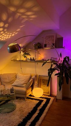 a living room filled with furniture and a purple light on the wall above it's windows