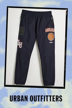 Lincoln University UO Exclusive woven jogger sweatpants from our limited-edition Lincoln University merch collection. Warm-up joggers in a regular fit with a pull-on waist and Lincoln University patch detailing at the legs. Finished with side and back pockets and two zip pockets. Lincoln University is the nation’s first degree-granting HBCU, and with this exclusive merch drop, UO has committed to a donation to the school. Find them only at Urban Outfitters. Features Lincoln University UO Exclusive woven jogger sweatpants Part of our exclusive Lincoln University collection With this exclusive merch drop, UO has committed to a donation to the school UO exclusive Content + Care 50% Polyester, 50% cotton Machine wash Imported Size + Fit Measurements taken from size Medium Rise: 10" Inseam: 29" Navy Athleisure Joggers For Streetwear, Navy Sweatpants For Streetwear, Sporty Graphic Print Joggers For Sports, Navy Relaxed Fit Joggers For Streetwear, Navy Sporty Joggers For Streetwear, Sporty Pants With Graphic Print For Sports, Sporty Graphic Print Joggers For Streetwear, Sporty Cotton Bottoms By Urban Outfitters, University Merch