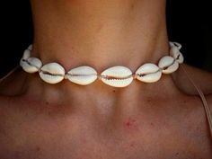 Cowrie shell choker necklace made by hand, using ivory color waxed thread, 100% waterproof and washable, you can even enjoy the necklace while taking a swim!Necklace can be worn in different lengths to fit your each time needs. Adjustable closure that tightens and looses with ease for an excellent fit. Just pull the endings and the necklace will close on the length you wish.Consists of natural pieces of cowrie shells, plus two smaller shells as a decorative touch, at the endings of the necklace. Cheap White Shell Necklaces, Cheap White Shell Necklace For Beach, Elegant Cheap White Shell Necklace, Cheap Beachy Shell-shaped Necklace, Cheap Casual Shell, Cheap White Shell Beaded Necklaces, Cheap Handmade Choker For The Beach, Cheap White Necklaces For Beach, Cheap Adjustable Choker For Beach