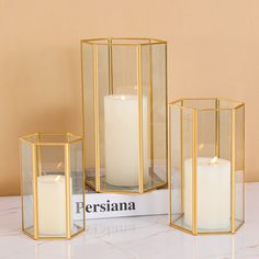 PRICES MAY VARY. 【Home Wedding Decor & Gift 】The transparent glass shade of candle holder, along with gold metal frame, simple design is suitable for many occasions, like wedding, anniversary, Christmas, Valentine etc., also a great choice for gifts and home decor 【Elegant Home Decoration】Illuminate any space with this set of 3 hurricane candle holders, featured in a geometric design to transform your living space with its refined, rustic look and provides the right ambiance for any occasion 【Qu Glass Candle Lantern, Modern Lanterns, Gold Candle Holders, Fantasy Land, Cosmoliving By Cosmopolitan, Centerpiece Table, Lantern Set, Candle Lantern, Frame Wedding