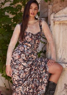 [Color: Black/Dusty Blue] A half body front facing image of a brunette model standing outside wearing a bohemian sleeveless maxi dress in a black and dusty blue floral print. With ruffled tank top straps Bohemian Maxi, Simple Sandals, Tank Top Straps, Bohemian Maxi Dress, Front Tie Top, Tier Skirt, Sleeveless Maxi Dress, Bohemian Dress, Ruffle Trim