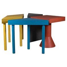 three tables with different colors and shapes on them