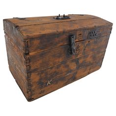 an old wooden chest with metal latches on the top and bottom, isolated against a white background