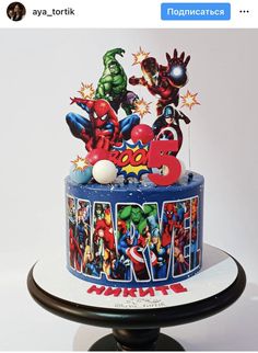 a birthday cake decorated with the avengers theme