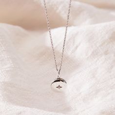 Our new Round Mini Locket Necklace is a dainty way to celebrate the love in your life! This tiny but meaningful necklace opens with space inside for two initials - perfect for you and your partner as a reminder that it all started with you falling in love. Or, engrave any two initials that are special to you! available in gold vermeil, sterling silver and 14k yellow gold locket can be engraved inside with one initial per side (uppercase only) hangs on adjustable cable chain locket measures 10mm in diameter gold vermeil and sterling silver lockets have a cubic zirconia stone in the front center Silver Necklace With Ethical Diamonds For Anniversary, White Gold Necklace With Si Clarity As A Gift, Minimalist Sterling Silver Locket Pendant Necklace, Sterling Silver Minimalist Locket Necklace As Gift, Minimalist Sterling Silver Locket Necklace Gift, Tiny Pendant Necklace For Anniversary, Delicate Silver Necklace For Anniversary Gift, Sterling Silver Initial Pendant Locket Necklace For Anniversary, Silver Minimalist Locket Charm Necklace