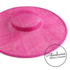 This cerise pink cartwheel hat base is a classic shape that has sprung into popularity in the past year. Made from 2 layers of stiffened sinamay, these cartwheels are ready to trim and are fitted with a petersham ribbon on the inside crown edge. Simply add a comb or headband to secure to the head.Hat base measures:Width: 35.5cm (14 inches)Crown Width: 13.5cm (5.3 inches)Crown Height: Approximately 3.5cm (1.7 inches)For even more millinery supplies you can find us here:www.etsy.com/shop/Petersham Adjustable Cloche Fascinator For Beach, Pink Brimmed Hat One Size, Pink Curved Brim Straw Hat, Pink Flat Brim Sun Hat One Size, Fitted Pink Flat Brim Sun Hat, Pink Fitted Flat Brim Sun Hat, Fitted Pink Hat With Curved Brim, Fitted Pink Hat With Flat Brim, Fitted Pink Hat With Short Brim