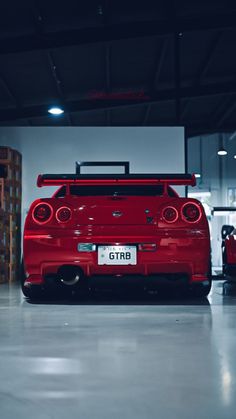 the rear end of a red sports car