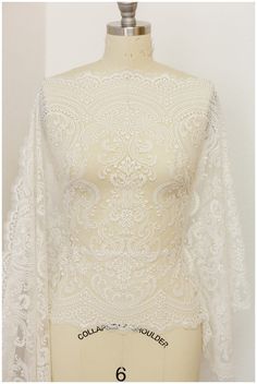 a mannequin with white lace on it