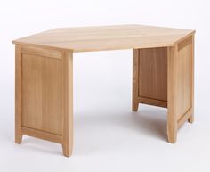 a small wooden desk with one drawer open