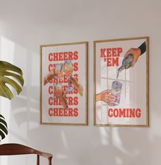 two posters hanging on the wall next to a wooden chair and potted palm tree