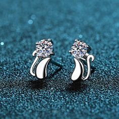 These unique stud earrings feature a cute kitten shape and are sure to please any cat lover. Crafted of Moissanite with an S925 finish, they are the perfect way to add a polished bit of fun to any outfit. Perfect for groovy looks, they always stay in style and are sure to dazzle. Order these Moissanite Earrings at an excellent price for yourself or indulge her on a particular day. Deluxe Gift Box included. GRA Certificate is unavailable as each Moissanite is under 0.5ct. Contact us if you want t Unique Studs, Stud Earrings Unique, Cat Earrings Studs, Stud Earrings For Men, Boys Jewelry, Sterling Silver Cat, Moissanite Earrings, Cz Stud Earrings, Diamond Stud Earrings