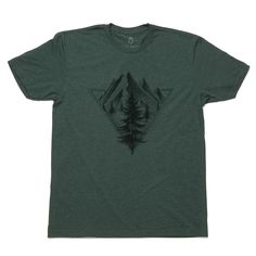 Our men's nature tshirt features pine trees. This mens mountain tee shirt showcases a hand drawn design of a mountain landscape locked into a geometric triangle frame! This is a super comfortable easy care shirt that you'll feel comfortable wearing all day. Our high quality tee makes a nice addition to your wardrobe and can be worn year round. It also makes a great gift for friends and family who love the outdoors. Black ink on Men's Poly-Cotton T-shirt | Heather Forest | All our inks contain no Green Graphic Print Shirt For Outdoor, Screen Print Tshirt, Black Graphic Print T-shirt For Outdoor, Mountain Tee Shirt, Triangle Frame, Green Graphic Print Outdoor T-shirt, Green Graphic Print T-shirt For Camping, Casual Adventure T-shirt With Custom Print, Mountain Tee