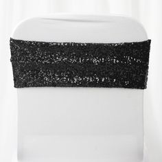 the back of a white chair with black sequins on it's side