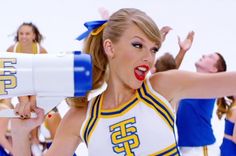 a cheerleader with her arms out and hands in the air, saying hate hate and taylor's gon na slay slay slay slay