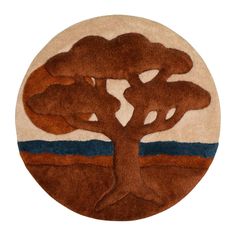 a round rug with a tree on it