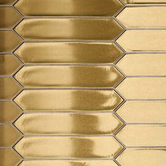 a close up view of some shiny gold tiles