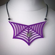 Gothic Spider Eternal Web necklace Beautiful detailed laser cut spiders web in a Purple gloss acrylic. Silver charm spider detail to the center and black beds to finish. Webs measure 8cm and make a great statement item. Please choose your different size chain from the drop down menu. This is for one necklace ONLY Gothic Purple Necklace For Halloween, Black Beds, Web Necklace, Gothic Spider, Acrylic Necklace, Quirky Jewelry, Gothic Gifts, Gothic Necklace, Black Bedding