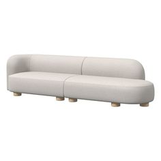 a white couch sitting on top of a wooden table