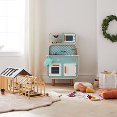 a child's play room with toys on the floor