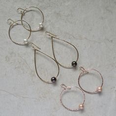 "White Freshwater Pearl Earrings~ These elegant sterling silver hoop earrings with a freshwater white pearl will look great for any occasion. Hammered and polished to a beautiful shine. Choose hoop size 1\" or 1.5\" Also available in 14k gold fill~ https://www.etsy.com/listing/199753367/white-pearl-hoop-earrings-small-gold?ref=shop_home_active_4 Also available with peacock pearls~ https://www.etsy.com/listing/269037112/peacock-pearl-earrings-freshwater-pearls?ref=listing-shop-header-0 Shop~bhttp Elegant Wire Wrapped Hoop Earrings For Anniversary, Silver Pearl Hoop Jewelry, Silver Hoop Jewelry With Pearl Drop, Silver Small Hoop Pearl Earrings For Anniversary, Silver Teardrop Pearl Hoop Earrings, Silver Small Hoop Pearl Earrings For Wedding, Sterling Silver Hoop Earrings With Pearl Drop For Anniversary, Silver Teardrop Hoop Earrings With Pearl Charm, Nickel-free Hoop Pearl Jewelry