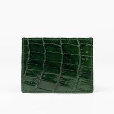 Compact In Size But Big In Style, Our Genuine Crocodile Skin Credit Card Case Is Your Sleek Companion That Makes Your Essentials Look Chic. Discreet And Practical, Our Credit Card Cases Lets You Flash Just Enough Of That Platinum. Features: Genuine Crocodile Skin Six Card Slots Top Opening For Cash Classic Green Crocodile Pattern Bag, Designer Crocodile Pattern Wallet, Designer Green Bags With Card Slots, Designer Crocodile Pattern Rectangular Wallet, Designer Green Bag With Card Slots, Elegant Green Bifold Wallet, Elegant Green Formal Wallet, Green Elegant Formal Wallets, Formal Green Rectangular Wallet