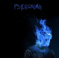 a man with blue fire on his face and the words psychdrama written above him