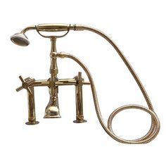 an old fashioned brass faucet and shower head